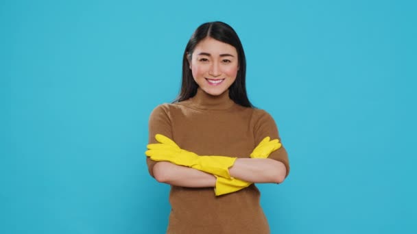 Smiling Professional Maid Wearing Protective Rubber Gloves Standing Arm Crossed — Vídeos de Stock