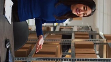 Vertical video: Business owner working on digital marketing with video, filming vlog for social media marketplace. Female entrepreneur making ad promotion campaign for development, teleshopping