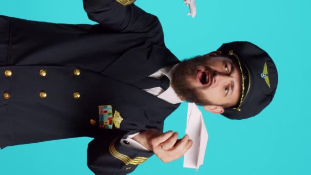 Vertical Video Airline Pilot Playing Paper Mini Airplane Having Fun — Vídeo de stock