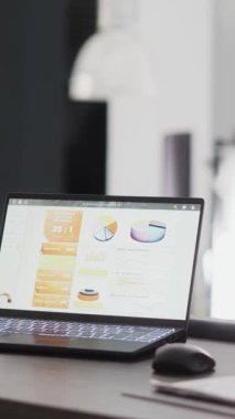 Vertical video: Office boardroom filled with statistics files and pc, empty workstation or desk in business department room. Corporation workplace in open space, interior of digital agency management.
