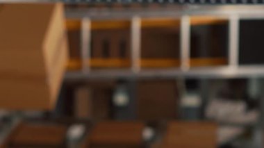 Vertical video: Empty storehouse space with stock products to work on logistics and ship distribution orders. Storage warehouse filled with cardboard packages and boxes on shelves, small business.