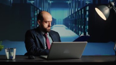 IT infrastructure specialist working in render farm, creating online networking system for digitalization. Network engineer using hardware and web storage in modern data center.