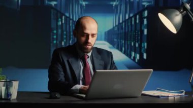 Frustrated database admin making mistake in data center, working under pressure with mainframe computer processor. IT technician checking server system quality maintenance, ai concept.