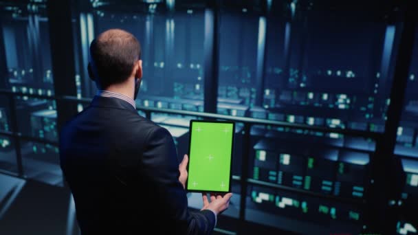 Data Center Technician Holding Tablet Green Screen Server Room Looking — Wideo stockowe
