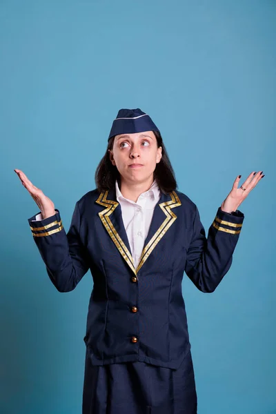 Young Confused Stewardess Shrugging Shoulders Showing Unsure Gesture Looking Upwards — Stock Photo, Image