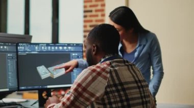 Artistic digital technicians talking about machine development, working together on clamp prototype. Professional graphic engineers developing industrial engine product using specialized software.