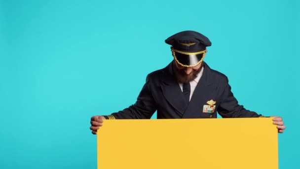 Cheerful Commercial Pilot Showing Empty Mockup Board Camera Working Advertisement — Wideo stockowe