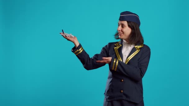 Smiling Stewardess Showing Artificial Plane Toy Feeling Confident Aviation Profession — Stok video