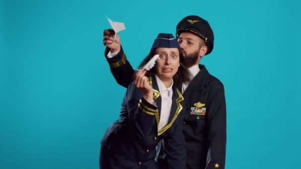 Couple Aviators Playing Toy Paper Airplane Studio Having Fun Folded — Wideo stockowe