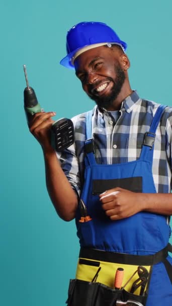 Vertical Video African American Man Using Power Drilling Tool Wall — Stockvideo