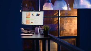 Corporate worker sitting at desk to work overtime, analyzing financial investment graphs for business development. Advisor agent typing data diagrams, checking marketing statistics.