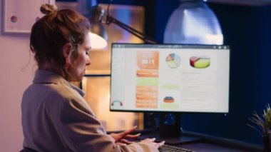 Focused woman planning financial investment charts, typing business profit or growth on pc. Female assistant analyzing diagrams for official report, checking progress in corporate office.