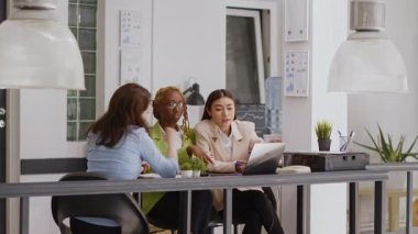 Business agency workers discussing about research plan, checking online analytics in startup briefing meeting. People doing collaboration to work on company profit development.