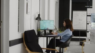 Professional person checking analyzing growth online, looking at economy statistics on computer screen. Business employee planning e commerce development and research for annual report.