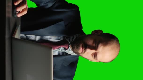 Vertical Video Businessman Working Laptop Greenscreen Backdrop Using Documents Desk — Vídeo de Stock