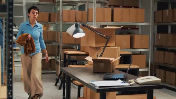 Female Entrepreneur Using Warehouse Supplies Put Cardboard Boxes Planning Delivery — Stock video