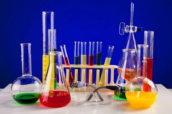 Chemistry Lab Set Colored Chemicals Table Blue Background Glassware Biology — Stok fotoğraf