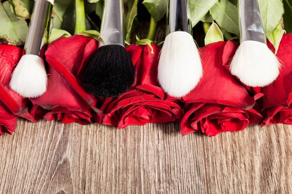 Conceptual Image Make Brushes Next Roses Wooden Background — Stock Photo, Image