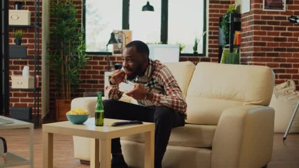 Happy Relaxed Man Eating Noodles Home Sitting Front Watching Film — Video