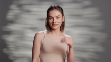 Flawless beauty model doing empowering campaign for self love and body positivity, using skincare cosmetics. Young beautiful adult feeling positive and confident, advertising tenderness.