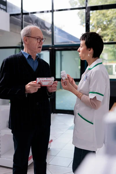 Senior Man Asking Drugstore Chemist Find Prescripted Heart Supplements Analog — Stock Photo, Image