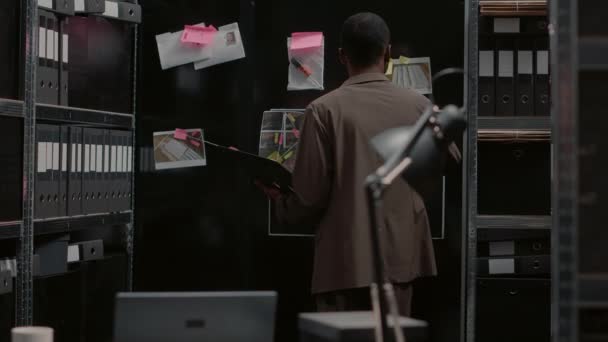 Law Inspector Putting Crime Information Wall Map Analyzing Files Physical — Αρχείο Βίντεο