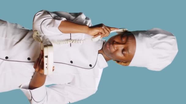 Vertical Video Young Gourmet Chef Using Retro Landline Phone Call — 图库视频影像