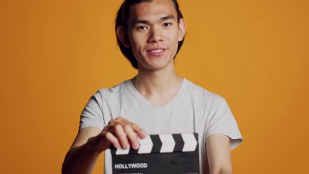 Excited Carefree Guy Using Film Slate Camera Working Movie Production — Stock Video