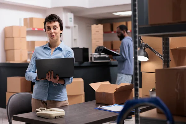 Storehouse Manager Holding Laptop Computer Checking Shipping Detalies While Working — Stock Photo, Image