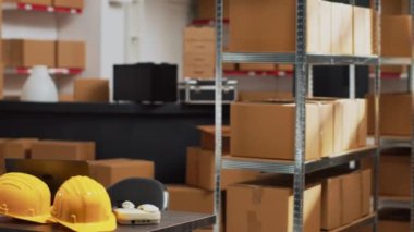 Empty storehouse space filled with multiple goods, storage room with carton packages on shelves. Stock merchandise placed on racks in warehouse, supply chain distribution management.