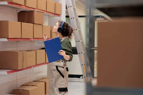 Worker Looking Carton Boxes Checking Shipping Details Listening Music While — Stock Photo, Image