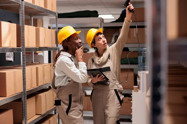 Two Young Warehouse Workers Using Barcode Scanner Equipment Stock Supervising — Stock Photo, Image
