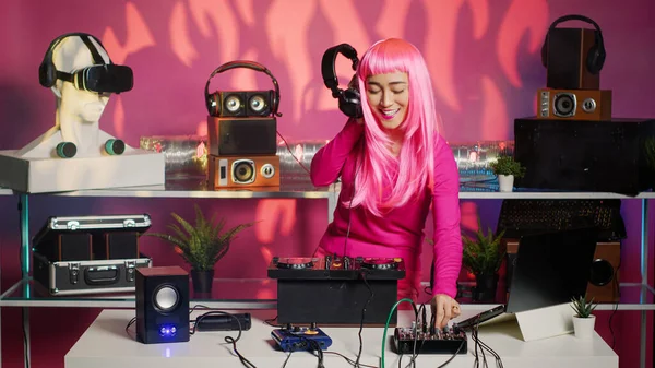 Asian Musician Playing Electronic Music Mixer Console While Having Fun — Fotografia de Stock