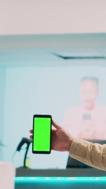 Vertical Video Man Worker Holding Smartphone Greenscreen Showing Blank Copyspace — Stock Video