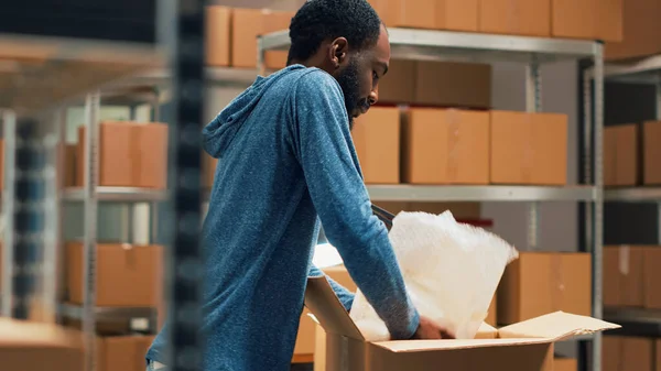 Male Owner Putting Goods Cardboard Boxes Shelves Working Distribution Order — Foto de Stock