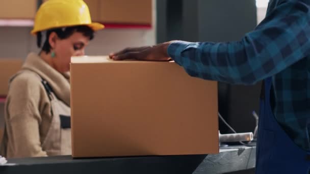 African American Man Putting Adhesive Tape Boxes Preparing Order Warehouse — Stock Video