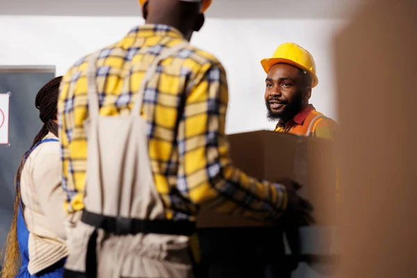 Warehouse Manager Looking Colleague Bringing Parcel Reception Desk Storage Room — Stock Photo, Image
