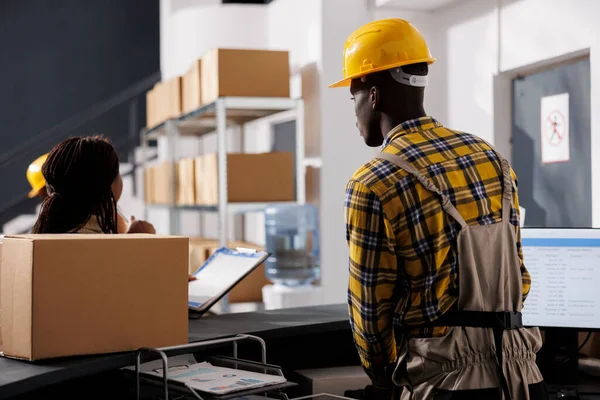 Courier Checking Orders List Receiving Parcel Retail Storehouse African American — Stock Photo, Image