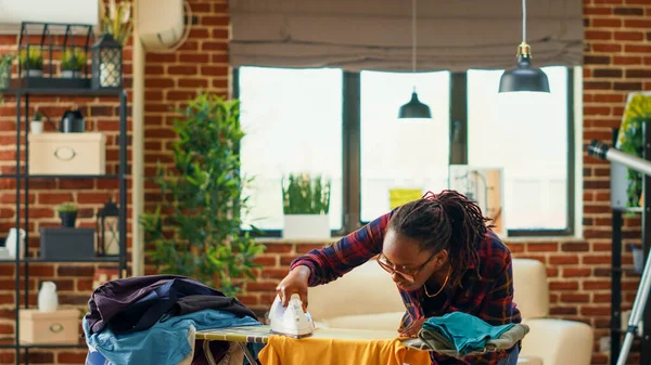 African American Woman Using Steam Iron Ironing Board Smoothing Out — Stock Photo, Image