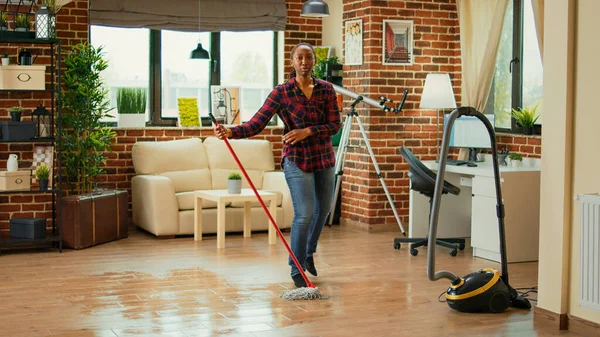 Happy Woman Dancing Living Room Using Mop Clean Floors Listening — Stok fotoğraf
