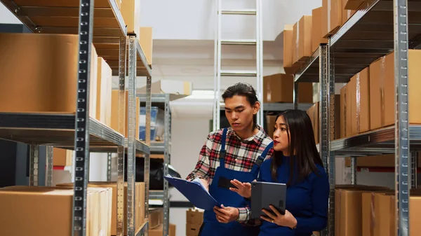 Asian Employees Checking Warehouse Supplies Tablet Files Working Storage Room — Stock Photo, Image