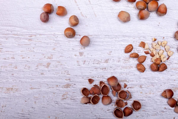 stock image Hazelnuts on wooden background. Over top view