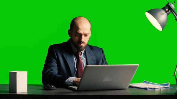 Concerned person making mistake over greenscreen, feeling angry about business fail. Corporate employee working under pressure on isolated mockup copyspace, blank chroma key background.