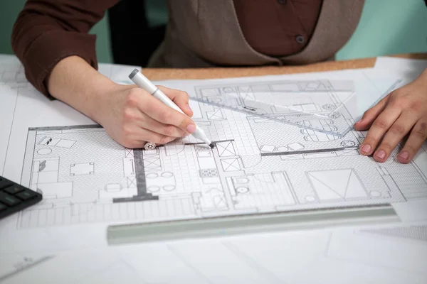 Details shot of architect blueprints on a desk. Business and creativity. Architecture job