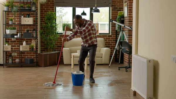 Cheerful Boyfriend Dancing Washing Floors All Purpose Cleaner Using Mop — Foto de Stock