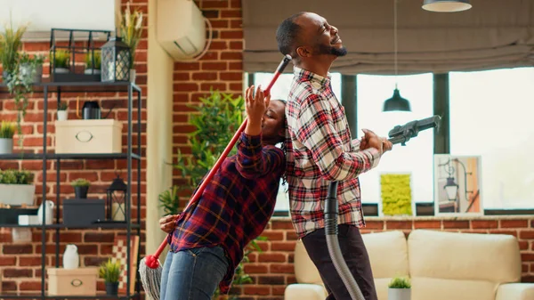 Happy Partners Showing Silly Dance Moves Cleaning Apartment Mopping Vacuuming — Foto Stock