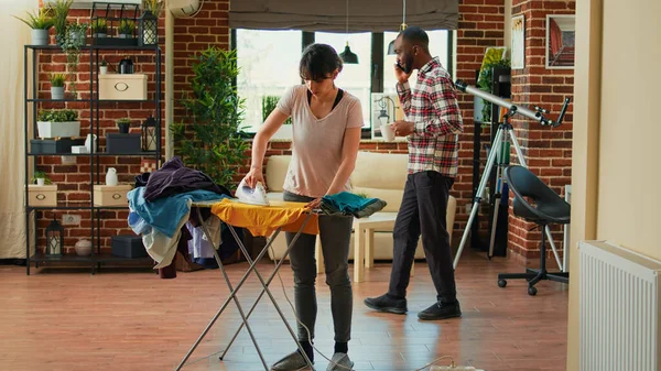 Angry Girlfriend Throwing Shirt Boyfriend Being Frustrated Ironing Clothes Home — Stock Photo, Image