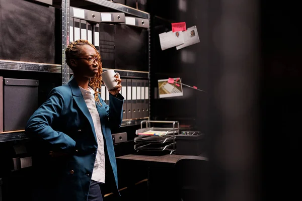 Concerned African American Woman Detective Drinking Coffee Thinking Crime Case — Stock Photo, Image