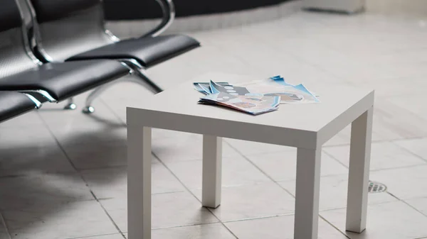 Empty Hospital Reception Lobby Medical Leaflets Table Registration Forms Used — Stock Photo, Image
