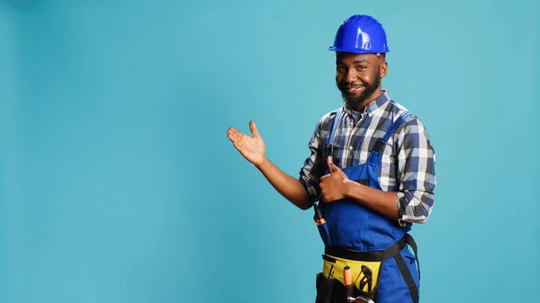 African American Repairman Pointing Something Studio Indicating Let Right Direction — Stock Photo, Image